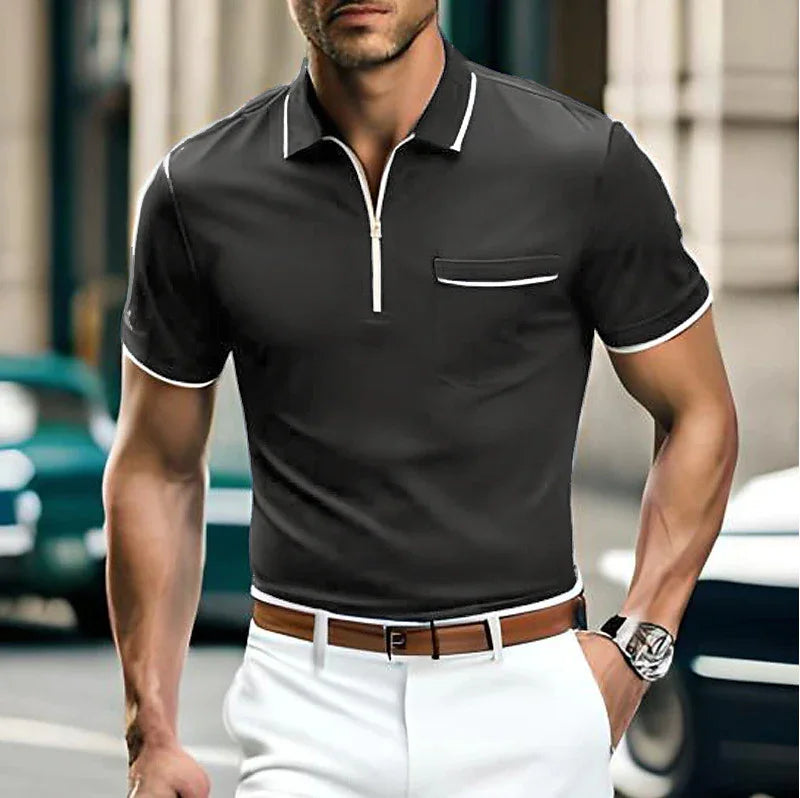 Man wearing black short-sleeve polo shirt with white trim and white pants, outdoor urban background