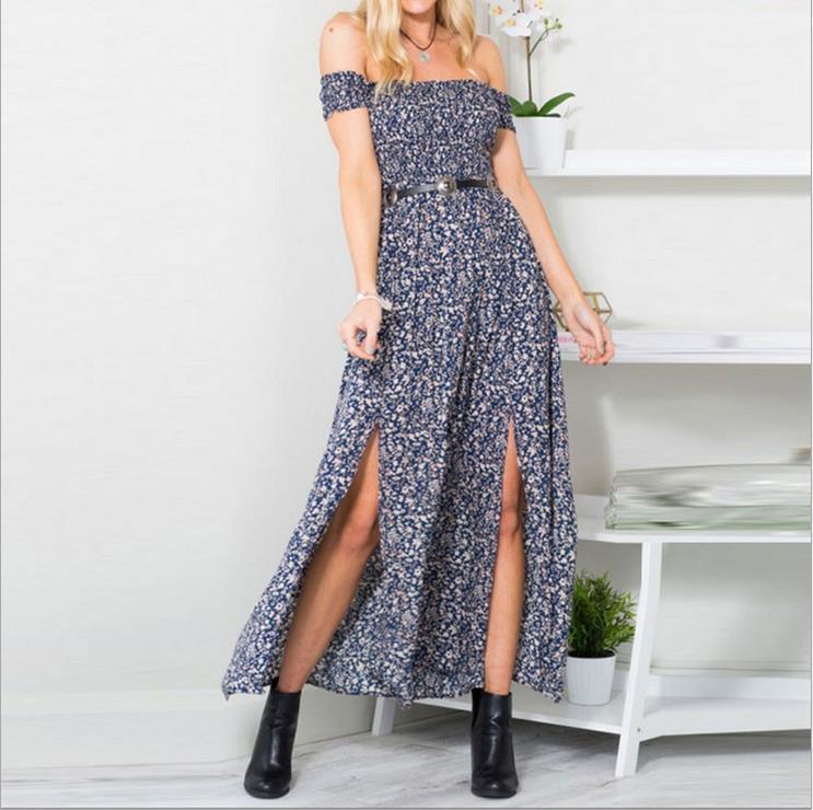 Woman wearing off-shoulder navy floral maxi dress with double front slits and black ankle boots
