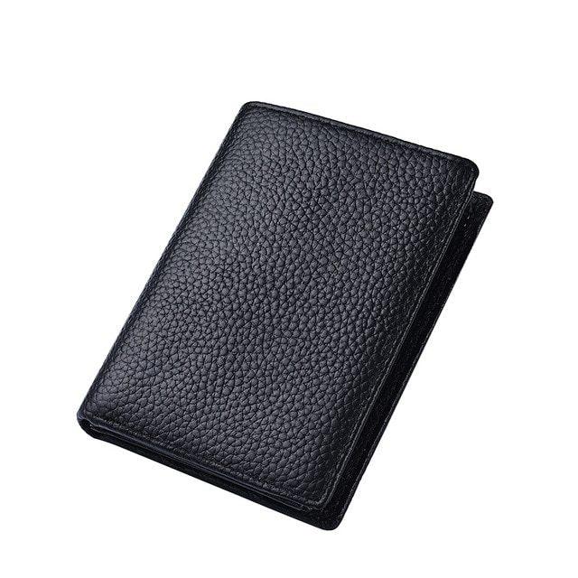 black textured leather wallet with fold design on white background