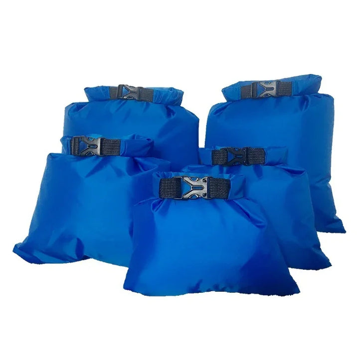 Set of five blue waterproof dry bags with buckles, ideal for outdoor camping or kayaking
