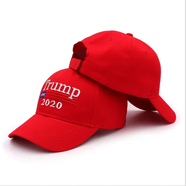 Red Trump 2020 embroidered baseball caps with adjustable straps on white background