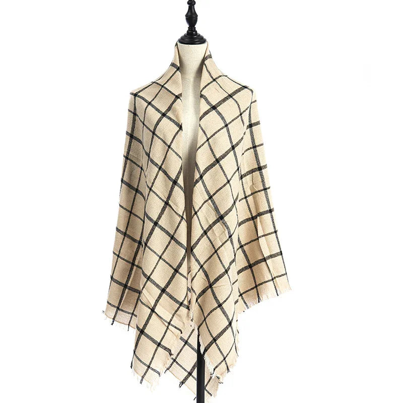 Beige and black checkered shawl draped on dress form mannequin with fringed edges
