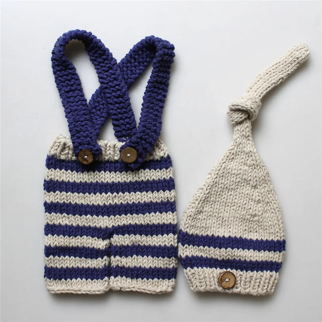 Knitted baby romper and matching hat with navy and cream stripes and wooden buttons