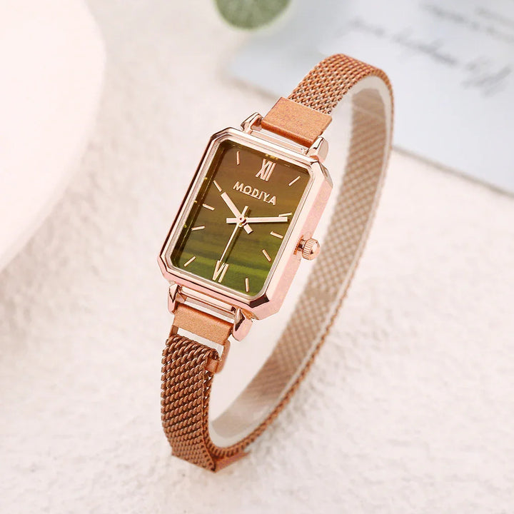 Rose gold rectangular wristwatch with mesh strap and MODIYA logo on green dial