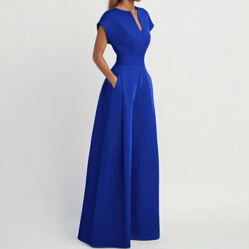Elegant royal blue maxi dress with cap sleeves and side pockets on model