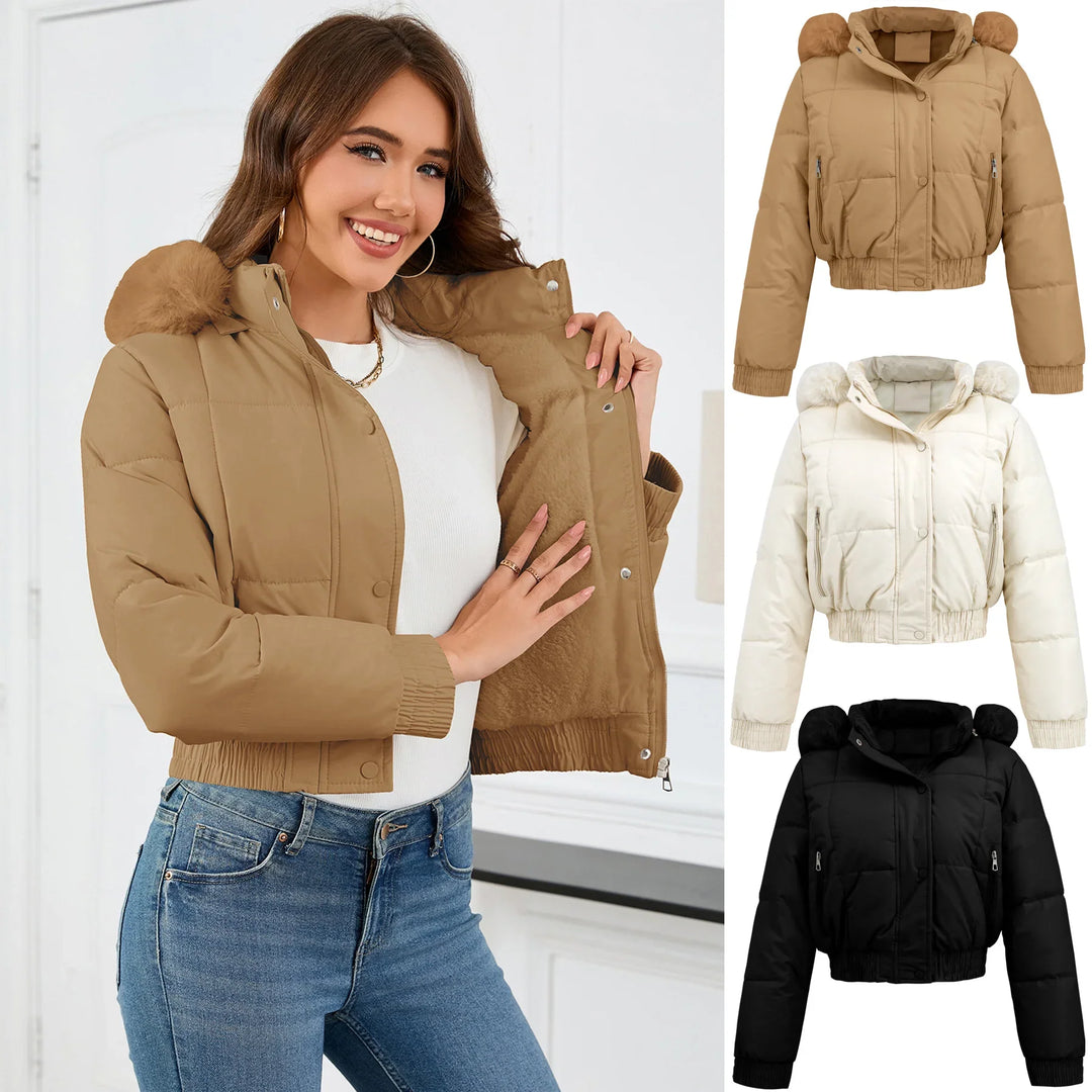 Woman wearing cropped puffer jacket with fur hood in beige, shown in beige, white, and black colors