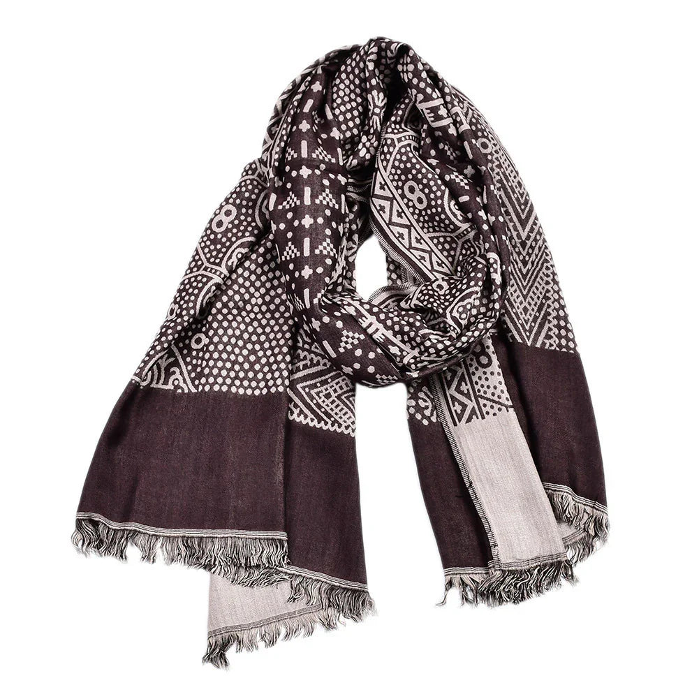 Brown and beige patterned scarf with fringe edges, featuring geometric and floral designs