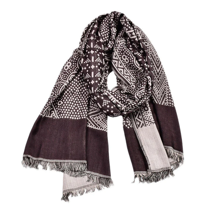 Brown and beige patterned scarf with fringe edges, featuring geometric and floral designs