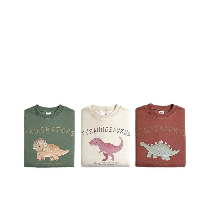 Folded kids sweatshirts with Triceratops, Tyrannosaurus, and Stegosaurus dinosaur prints