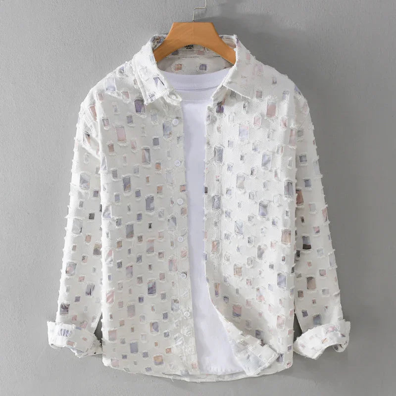 White sheer long sleeve shirt with square cutout pattern layered over plain white t-shirt on wooden hanger