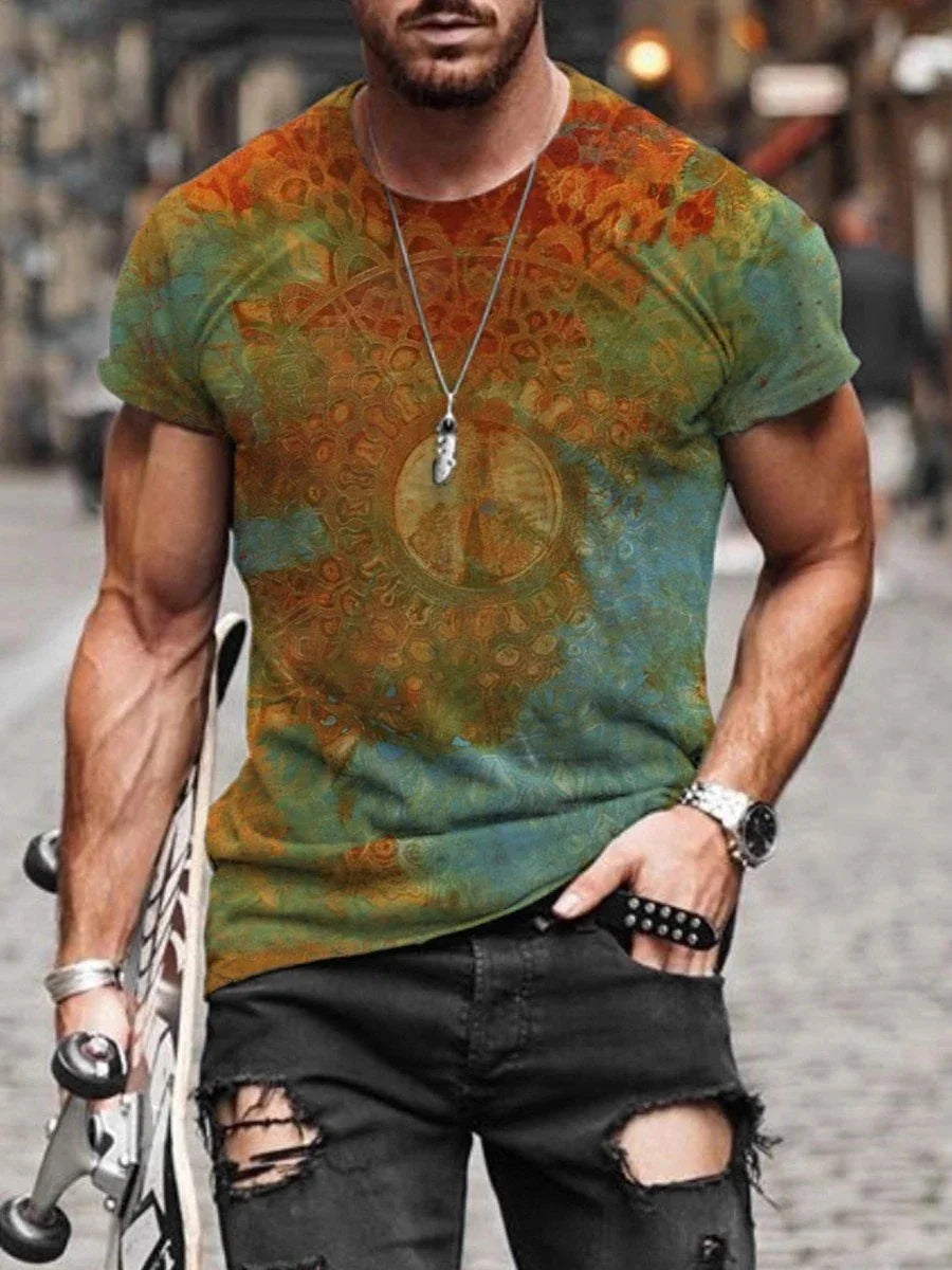Muscular man wearing colorful psychedelic patterned t-shirt and ripped black jeans holding skateboard
