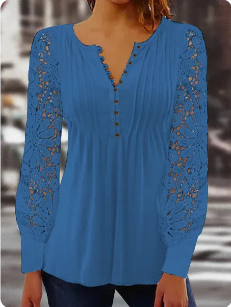 blue long sleeve blouse with lace floral sleeves and button detail on front