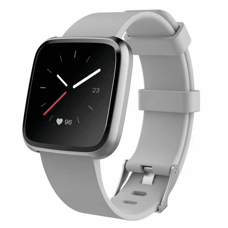 Grey fitness smartwatch with heart rate monitor and silicone band on white background