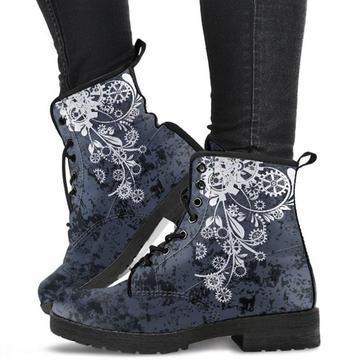 Black and gray lace-up combat boots with white floral and gear design worn with black pants