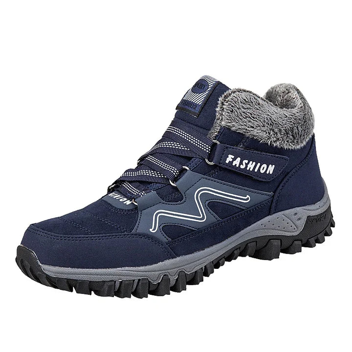 Navy blue winter hiking boot with gray fur lining, durable sole, and fashion label