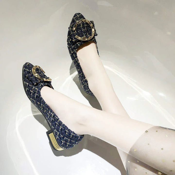 Elegant navy blue tweed block heel shoes with gold buckle detail worn with sheer star-patterned stockings