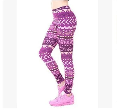 Woman wearing vibrant purple patterned leggings and pink sneakers, side view on white background