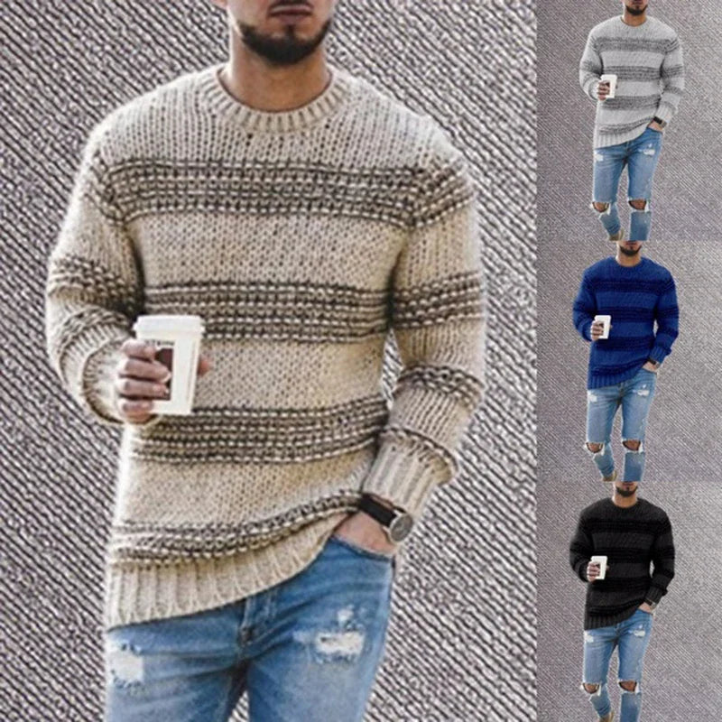 Man wearing striped knit sweater in beige, blue, and black colors, paired with ripped jeans and holding coffee cup