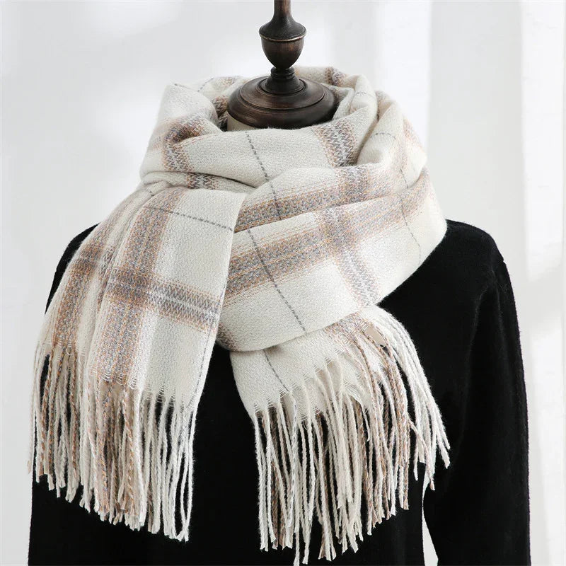 Soft white plaid scarf with beige and gray stripes and fringed ends on black mannequin