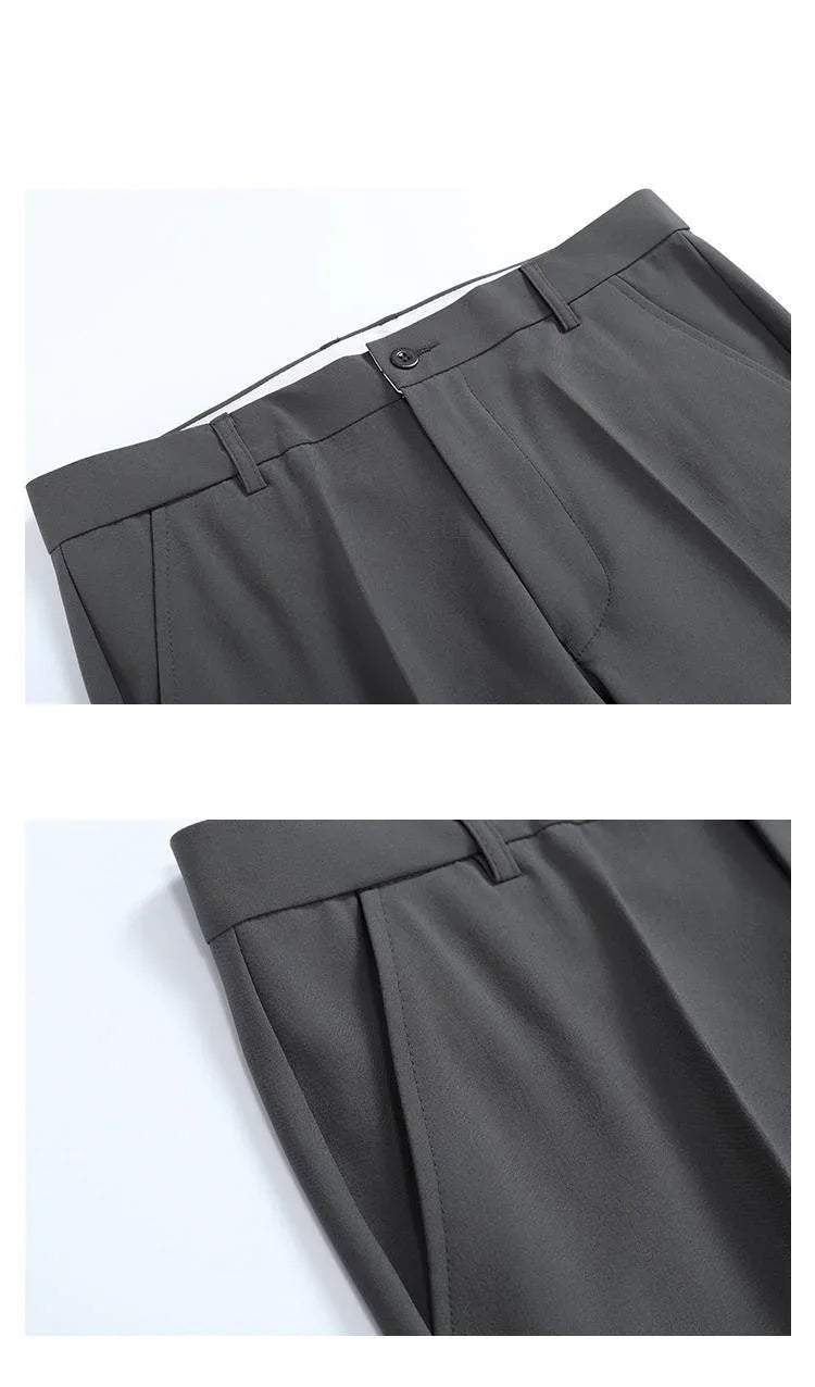 Dark gray tailored trousers with belt loops, front button closure, and side pockets