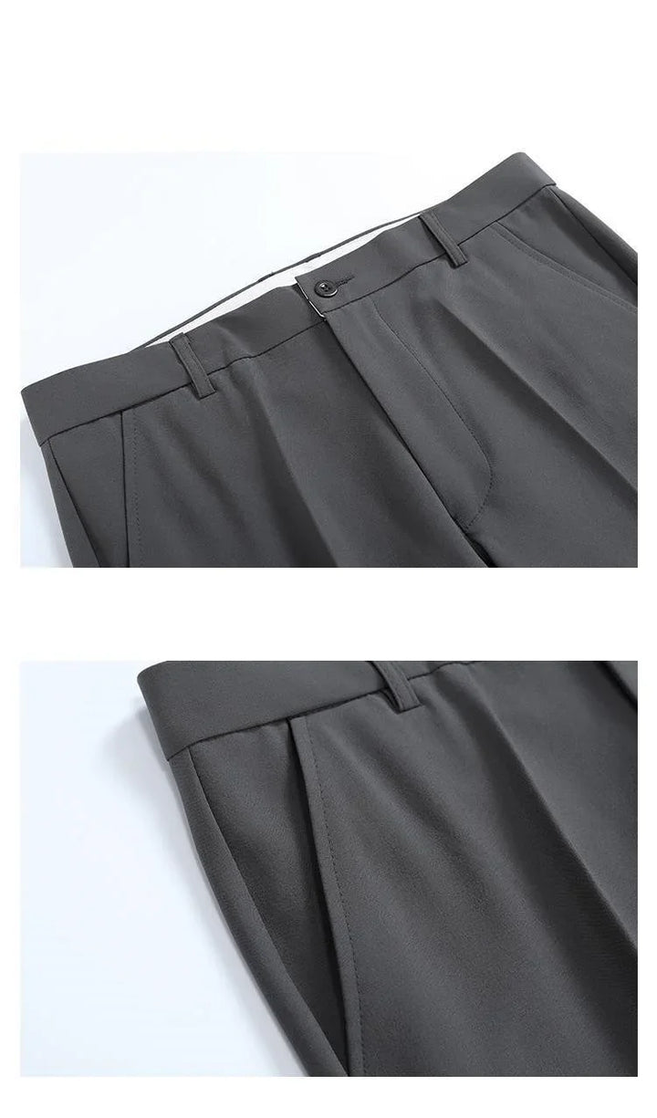 Dark gray tailored trousers with belt loops, front button closure, and side pockets