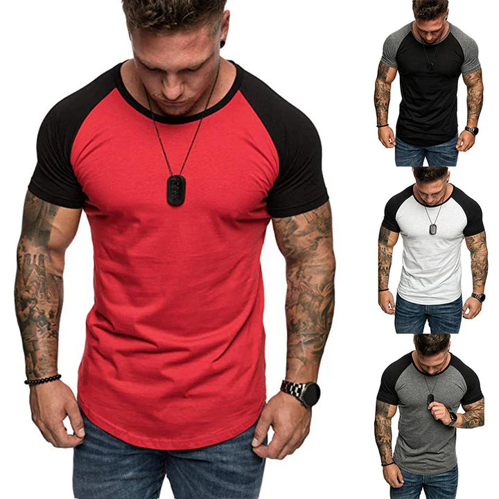 Muscular man wearing short sleeve color block raglan t-shirts in red, black, white, and gray with jeans