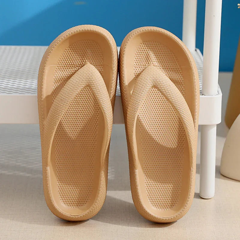 Beige textured flip-flops placed on a light floor next to a white metal shelf against a blue wall