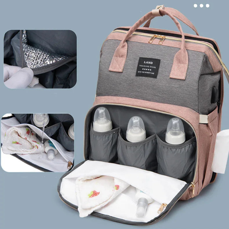 Gray and pink insulated baby bottle backpack with storage compartments and leakproof lining