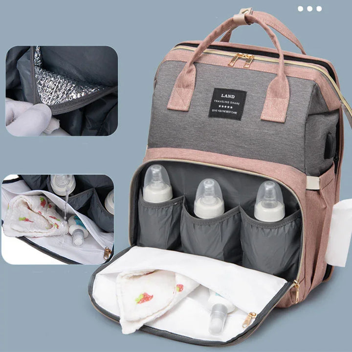 Gray and pink insulated baby bottle backpack with storage compartments and leakproof lining