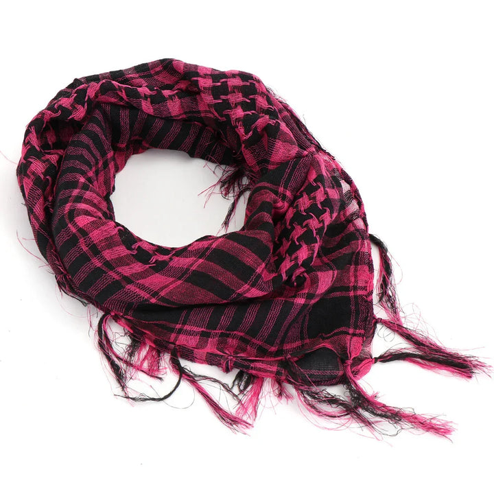 Pink and black checkered scarf with fringed edges on white background