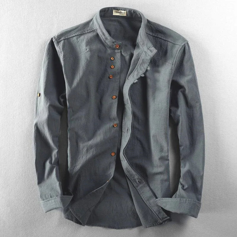 gray casual men's button-up shirt with mandarin collar and wooden buttons on light background