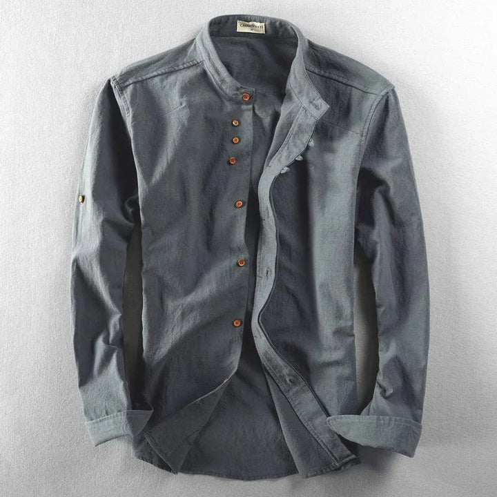 gray casual men's button-up shirt with mandarin collar and wooden buttons on light background