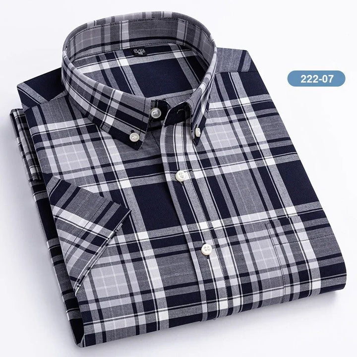 Folded short sleeve navy blue and gray plaid button-down shirt with white buttons