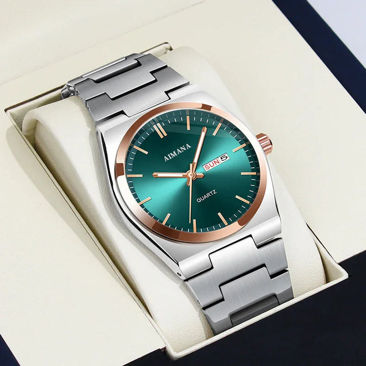 AIMANA quartz wristwatch with green dial and rose gold accents on silver metal band, displayed in cushioned box
