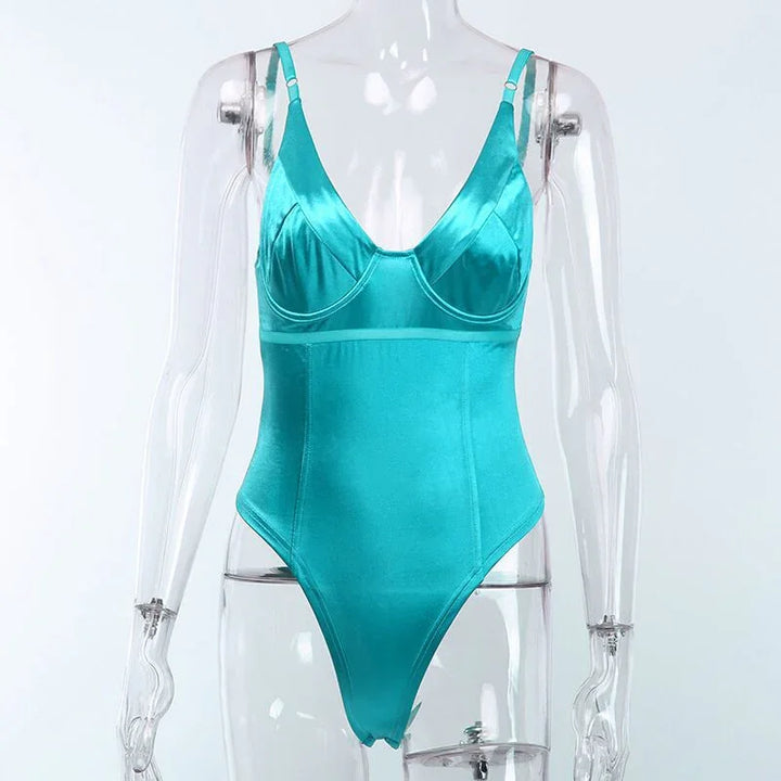 Turquoise satin bodysuit with adjustable straps displayed on clear mannequin against white background