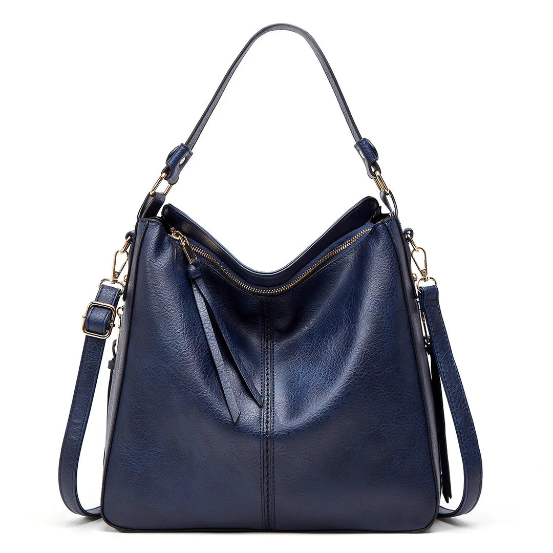 Elegant navy blue leather hobo handbag with gold zipper and adjustable shoulder strap