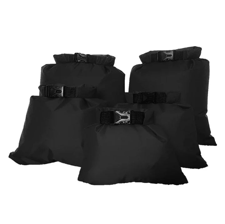 Set of black waterproof dry bags with buckle closures, displayed on white background