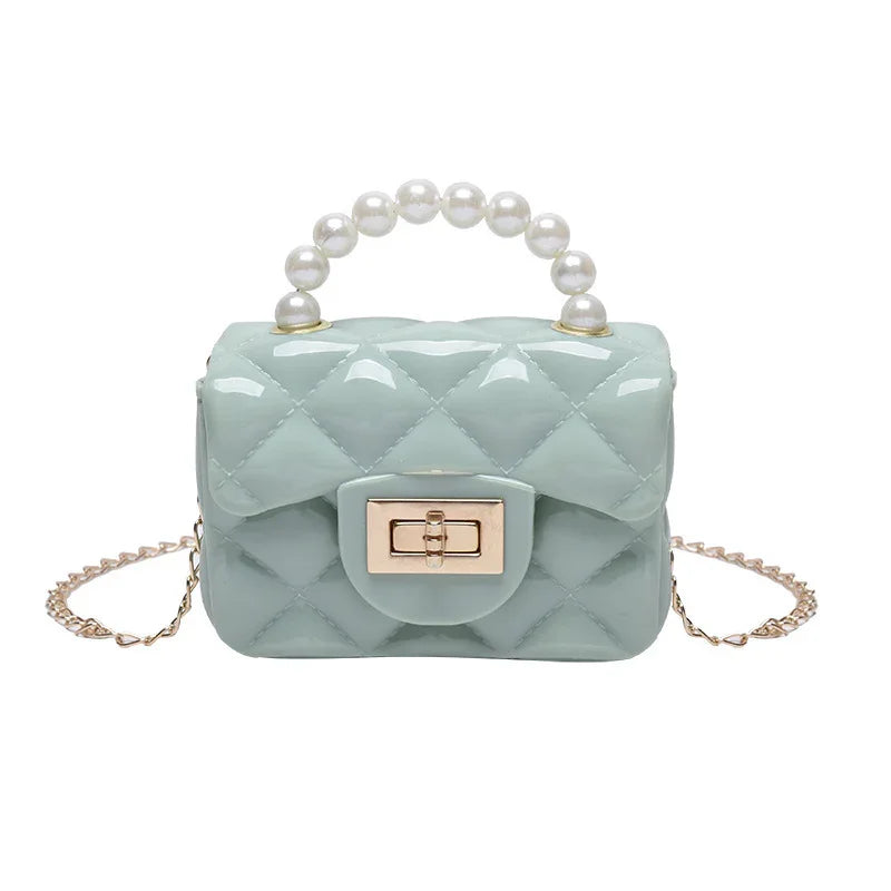 Glossy light blue quilted handbag with pearl handle and gold chain strap