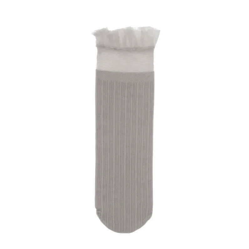 Single beige ribbed sock with white frilled cuff on white background