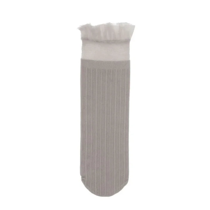 Single beige ribbed sock with white frilled cuff on white background