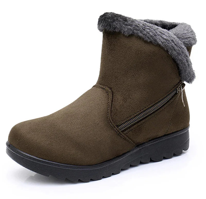 brown winter ankle boot with grey fur lining and side zipper on black rubber sole