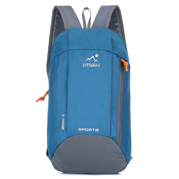 Blue and gray sports backpack with orange zipper pull, upright on white background