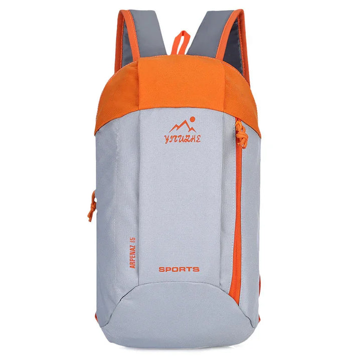 Gray and orange sports backpack with front logo and zipper, perfect for hiking or travel.
