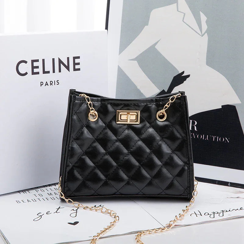 Black quilted leather handbag with gold chain strap and clasp, displayed with Celine Paris box