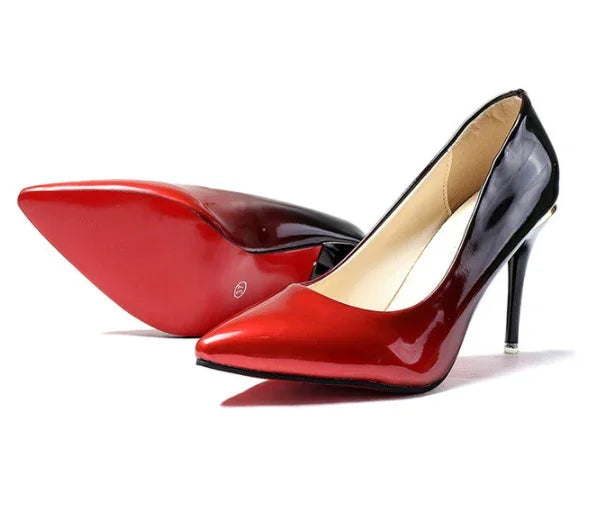 Glossy red and black high heel stiletto pumps with pointed toe and red sole