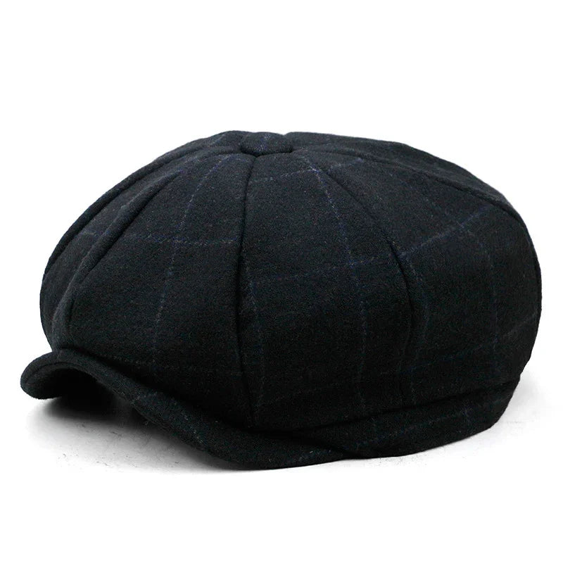 Black newsboy cap with subtle plaid pattern and short curved brim on white background