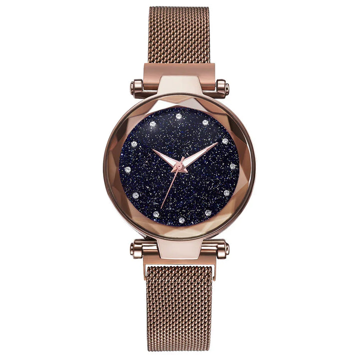 Rose gold mesh band wristwatch with sparkling dark blue starry dial and crystal hour markers