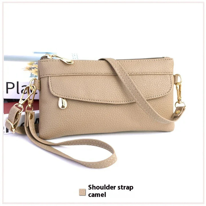 Camel color leather wristlet purse with detachable shoulder strap and gold hardware