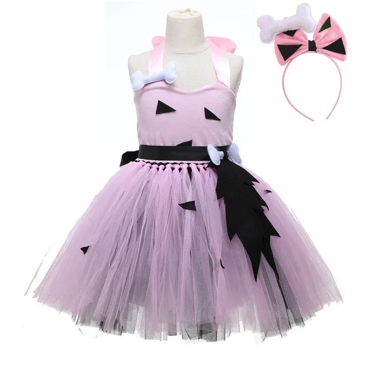 Pink tulle dress with black triangular patches and bone accents, includes matching headband with bow and bone