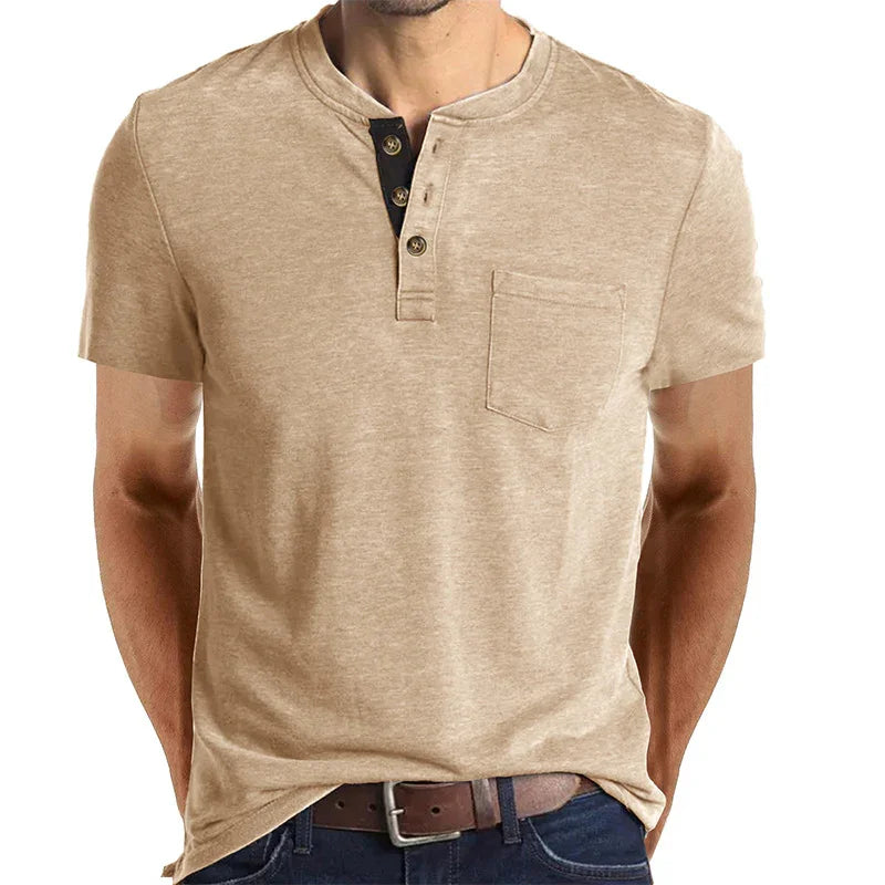 Beige short sleeve henley shirt with pocket and button placket, styled with belt and jeans